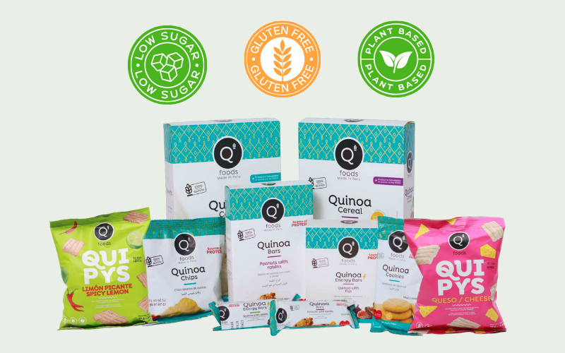 Assorted QFoods Europe quinoa snacks including bars, chips and quipys